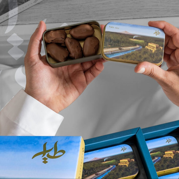 Al-Tayyar -Palm tree box dates covered with chocolate filled with almonds