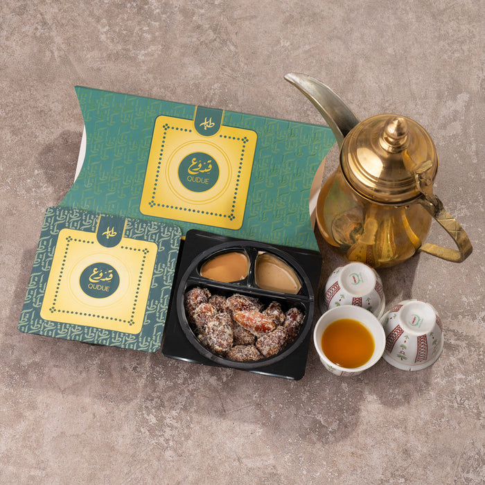 Al-Tayyar -Two boxes of stuffed Khalas dates with cardamom and tahini sauce